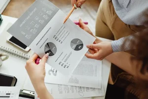 Marketing analytics reports and performance data being reviewed during business planning